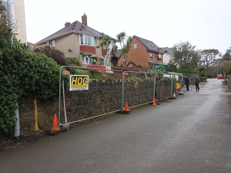 a wall with fencing around it