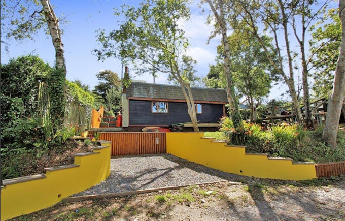 a sweeping driveway in front of a house