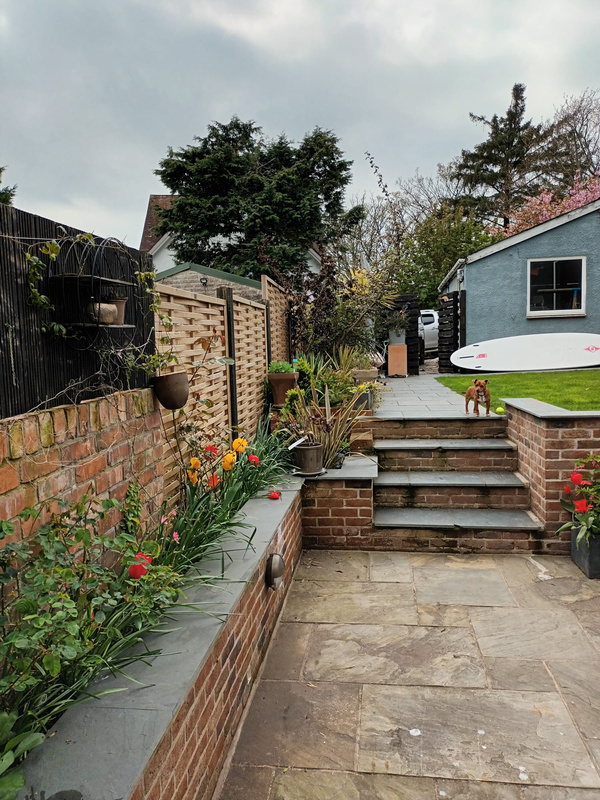 a patio with steps leading from it